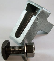 Wedge inserts and askew head bolts work simultaneously to prevent movement in relieving angles, shelf angles and lintels